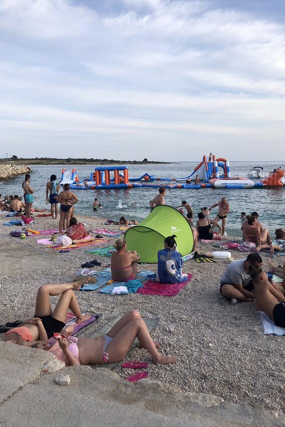 Nearest beach - Apartments and rooms with parking space Novalja, Pag