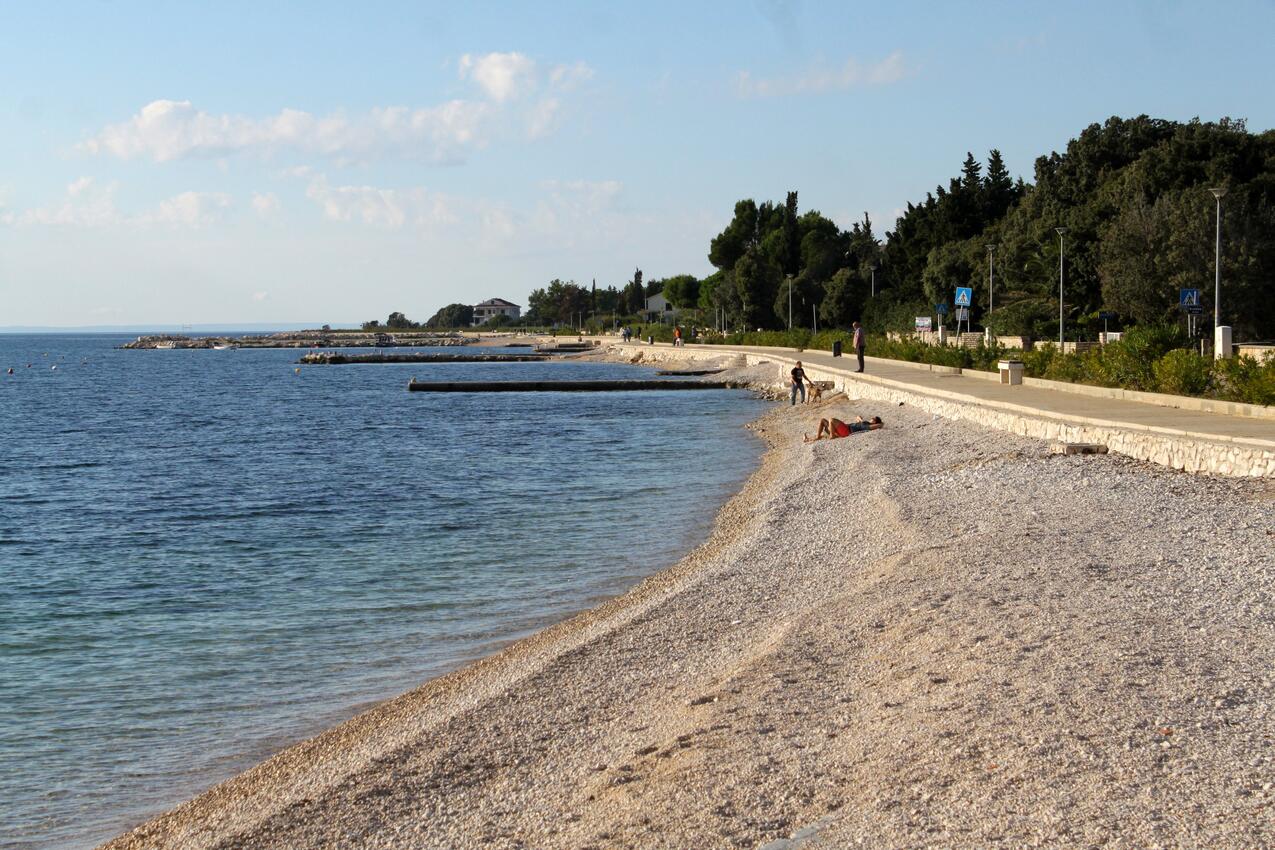 Nearest beach - Apartments and rooms with parking space Novalja, Pag