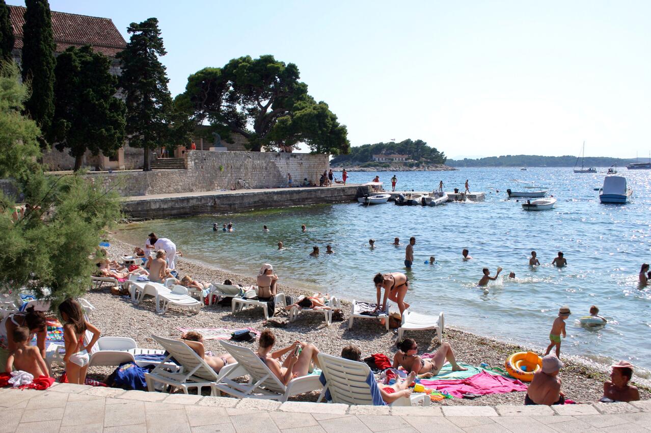 Nearest beach - Apartments and rooms with parking space Hvar