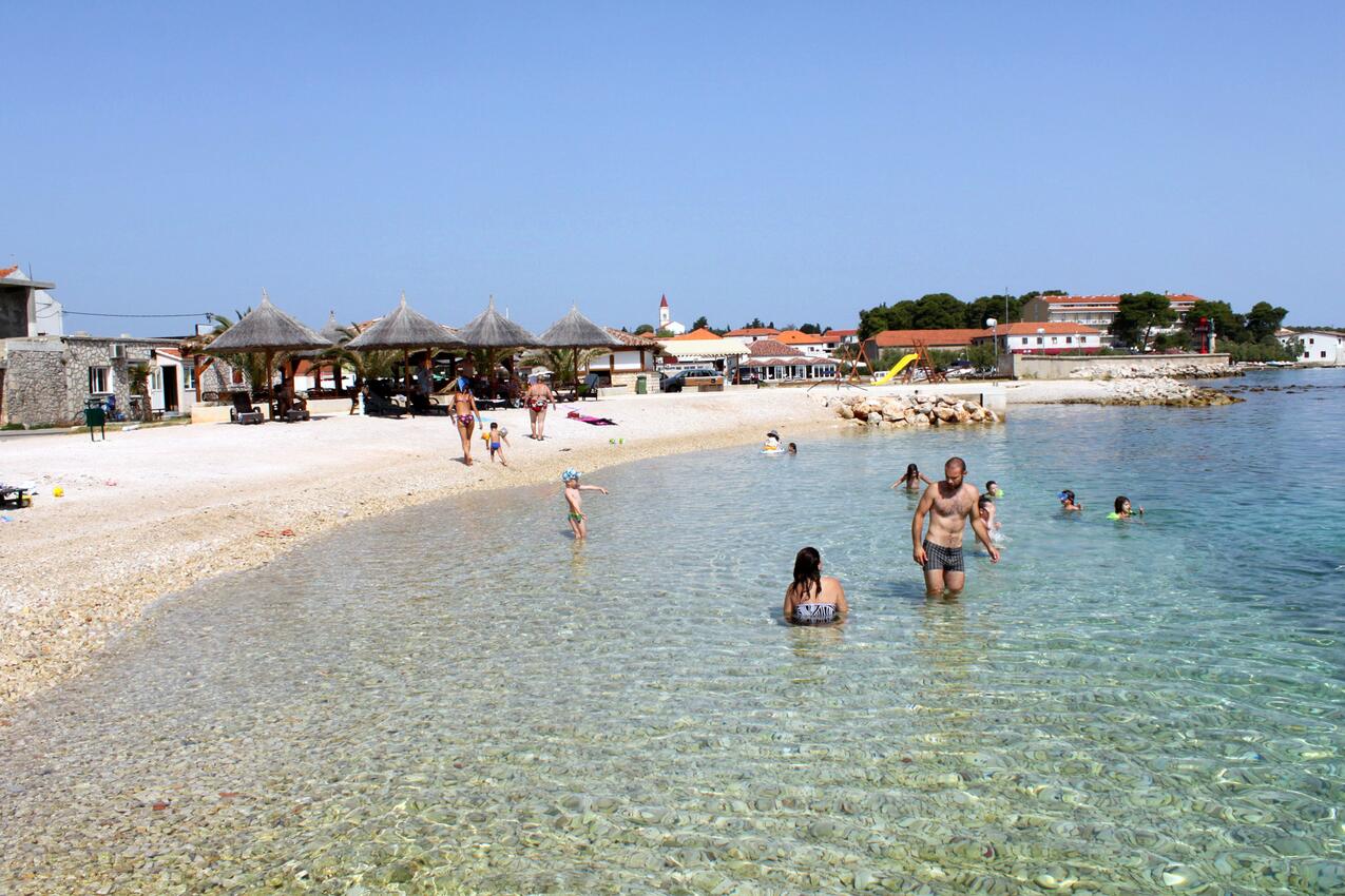 Nearest beach - Apartments with parking space Ugljan
