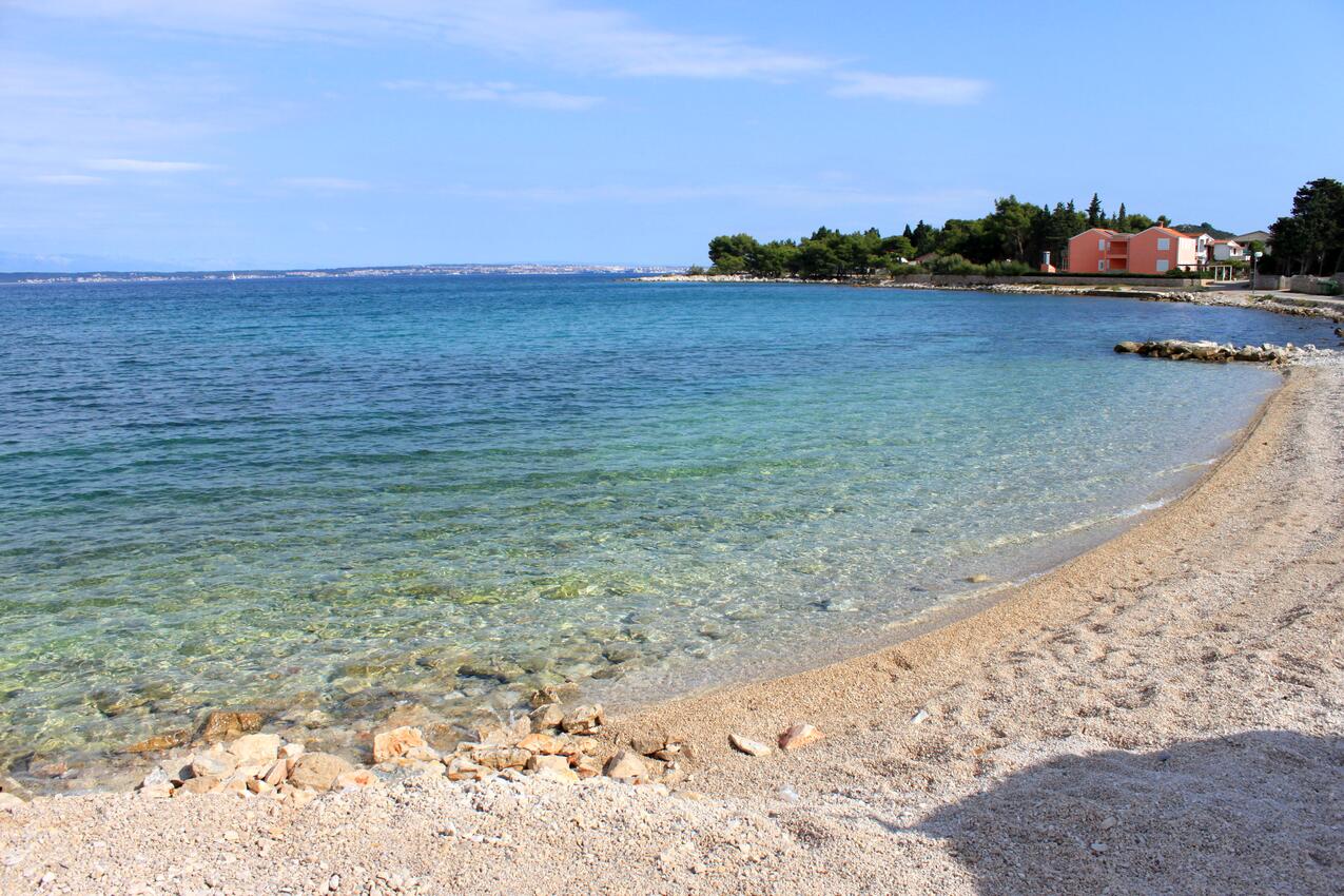 Nearest beach - Apartments with parking space Ugljan