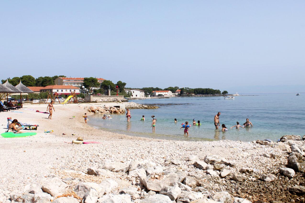 Nearest beach - Apartments with parking space Ugljan