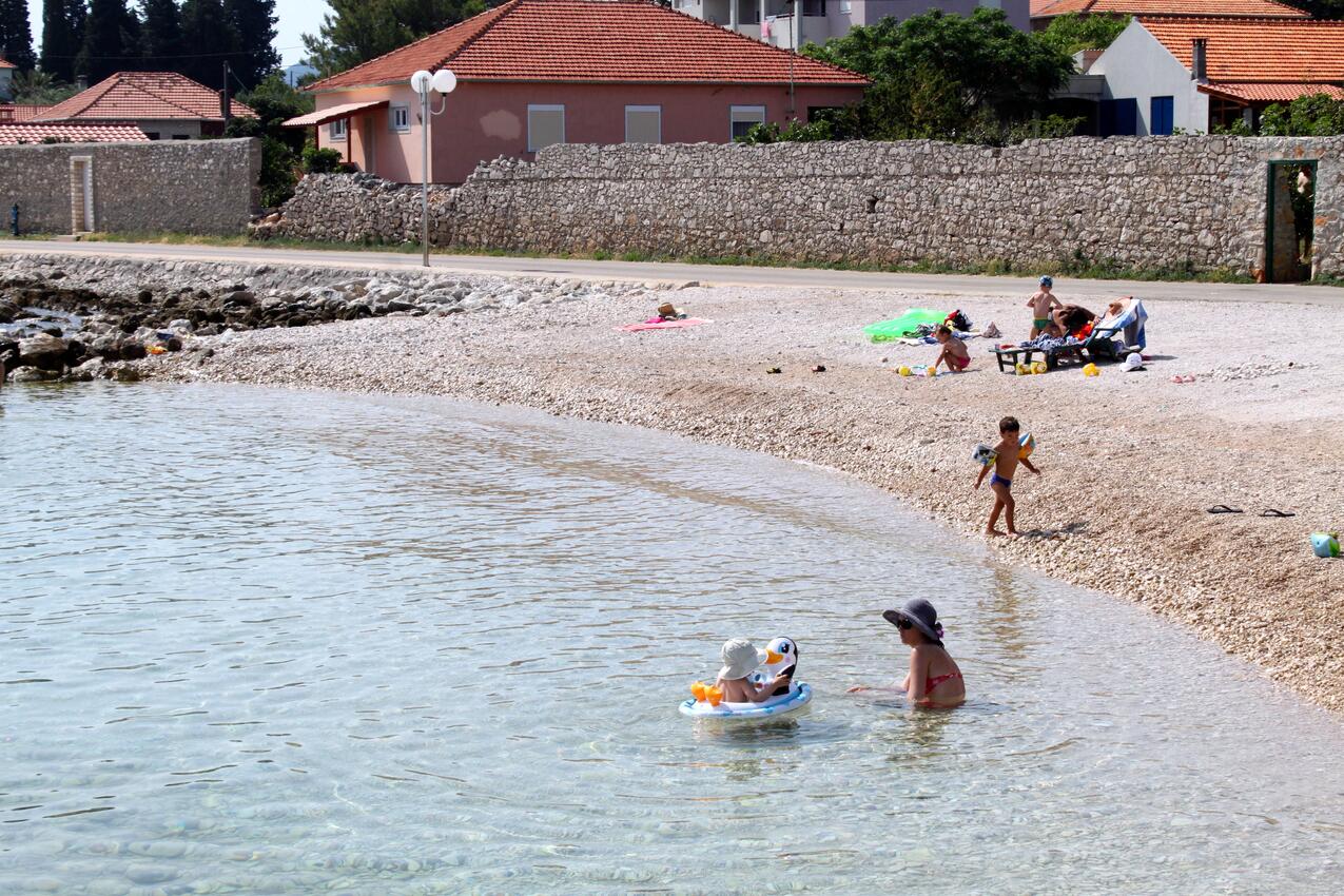 Nearest beach - Apartments with parking space Ugljan