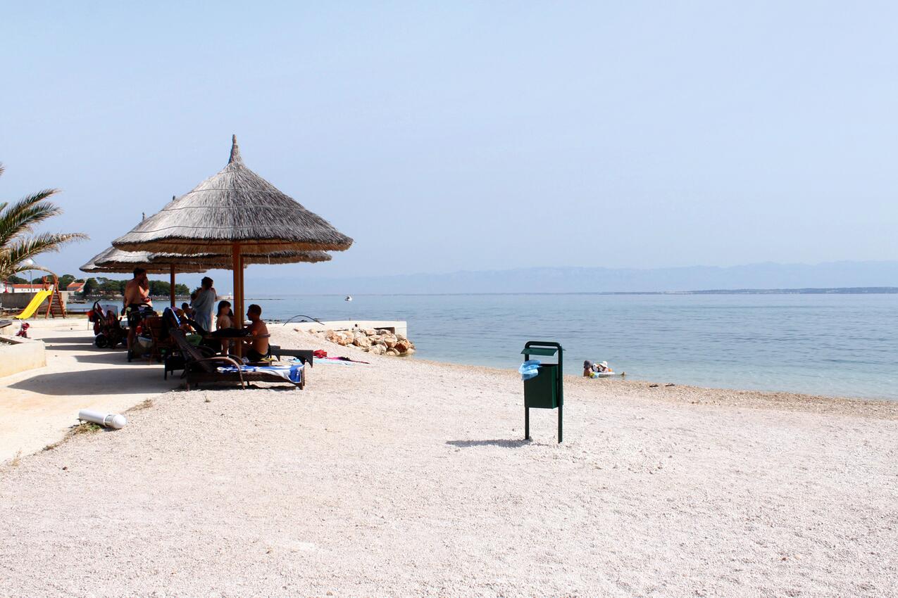 Nearest beach - Apartments with parking space Ugljan