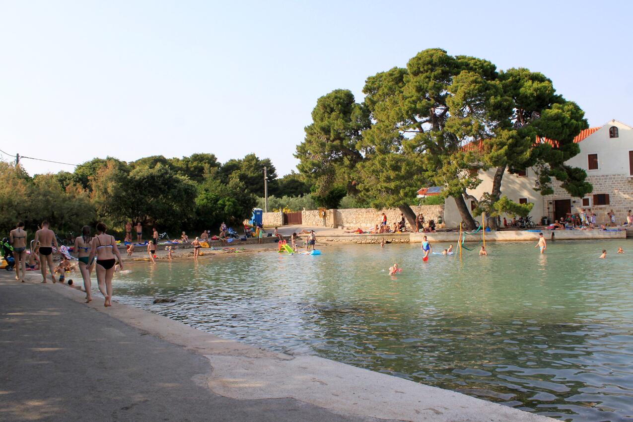 Nearest beach - Apartments with parking space Ugljan