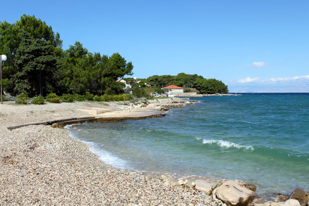 Nearest beach - Apartments with parking spaces Ugljan