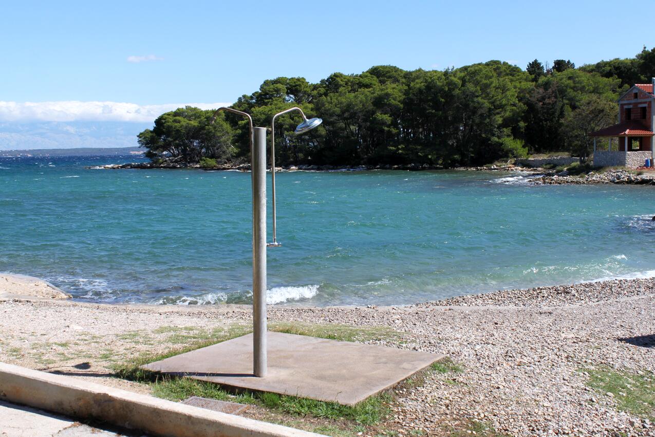 Nearest beach - Apartments with parking spaces Ugljan