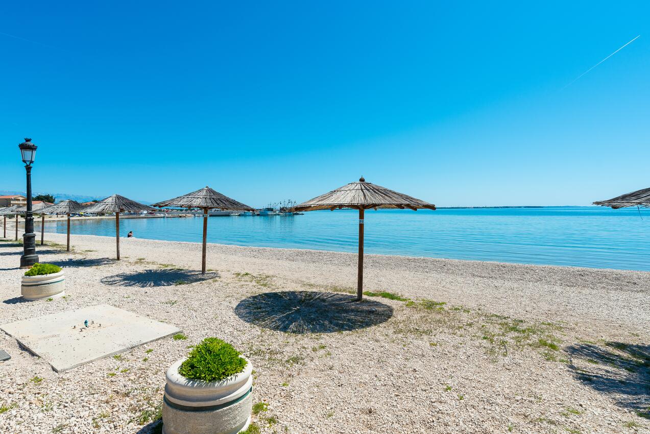 Nearest beach - Apartments with parking spaces Vir