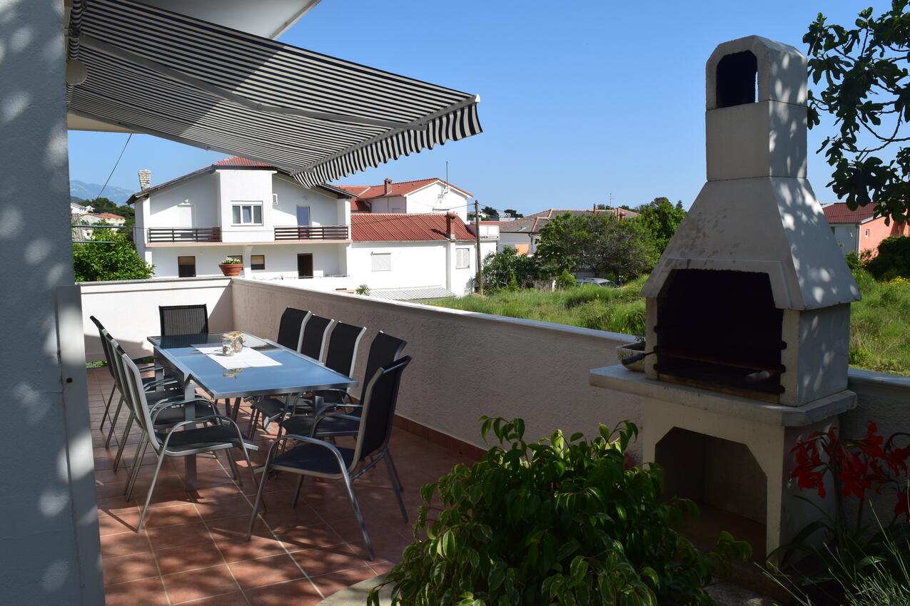 Apartments with a parking space Rab - 12383