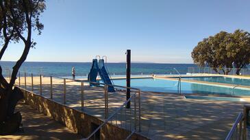 Appartamenti con piscina per famiglie Novaglia - Novalja, Pago - Pag - 13090