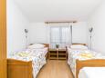 Kaštel Štafilić, Schlafzimmer 4 in folgender Unterkunftsart apartment, WiFi.