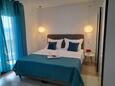 Duće, Bedroom 1 in the apartment, air condition available and WiFi.