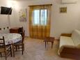 Baška, Living room in the apartment, air condition available and WiFi.