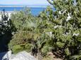 Crikvenica, Crikvenica, Jardín 23997 - Apartamentos con una playa de guijarros.