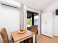 Šparadići, Dining room in the studio-apartment, air condition available and WiFi.