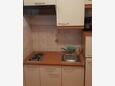 Lopar, Kuhinja u smještaju tipa studio-apartment, WiFi.