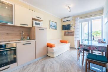 Supetarska Draga - Gonar, Living room in the apartment, air condition available, (pet friendly) and WiFi.