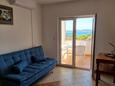 Drage, Living room in the apartment, air condition available, (pet friendly) and WiFi.