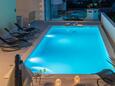 Seget Vranjica, Trogir, Udvar 24946 - Apartmanok kavicsos stranddal.