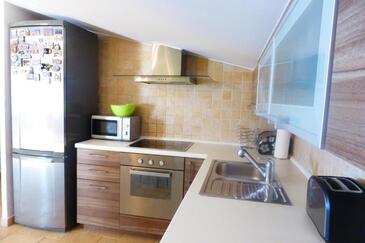 Apartments with parking space Senj - 25395