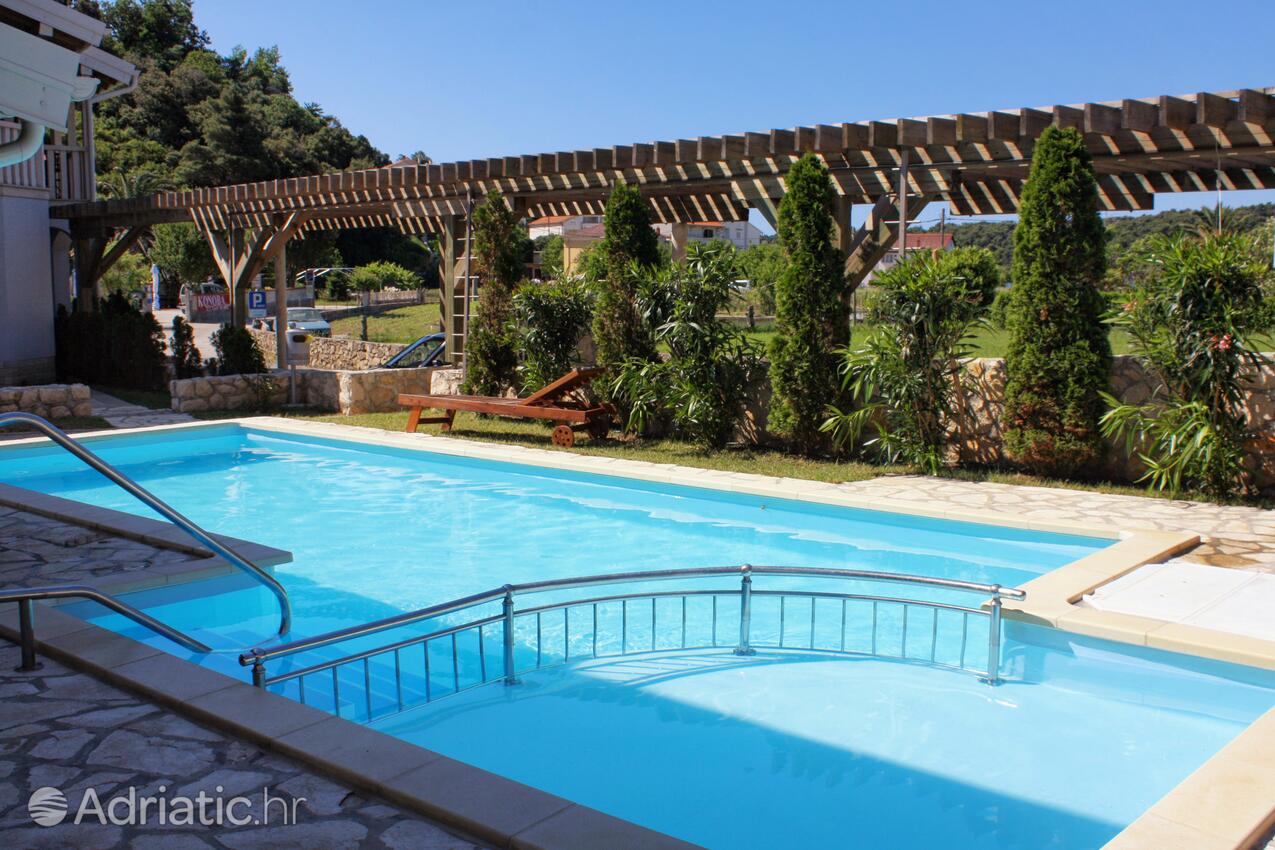 Family friendly apartments with a swimming pool Palit, Rab - 3210