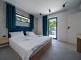 Schlafzimmer 1 Sumartin, Schlafzimmer 1 in folgender Unterkunftsart house, Klimaanlage vorhanden und WiFi.