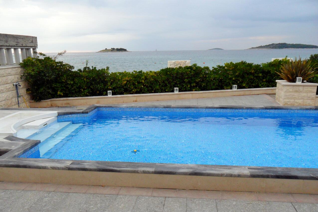 Courtyard - Family friendly apartments with a swimming pool Rogoznica